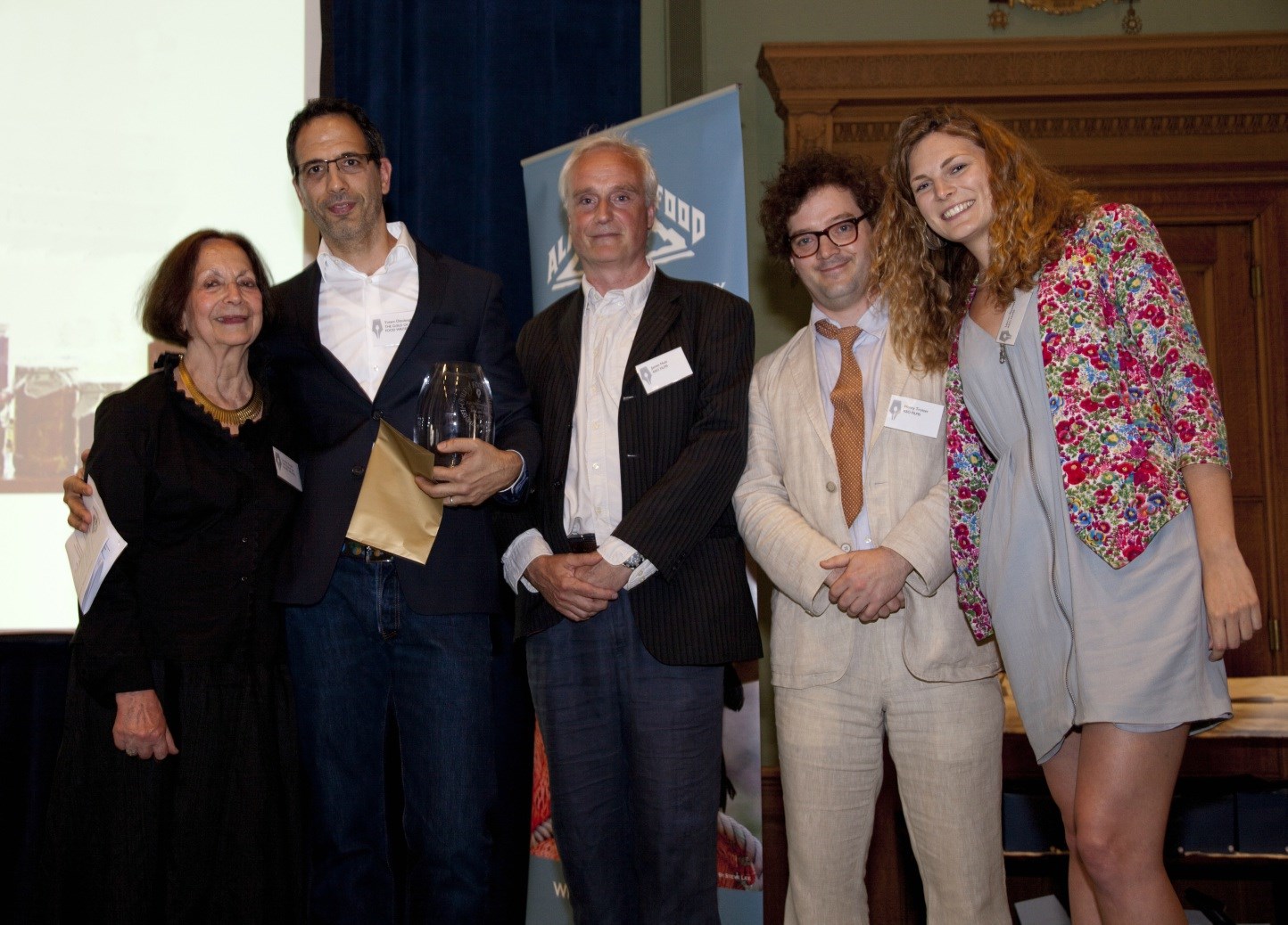 Claudia Roden presenting the Kate Whiteman Award for Work on Food and Travel to from left to right: Yotam Ottolenghi, James Nutt, Henry Trotter and Lauren Rowles from Keo Films
